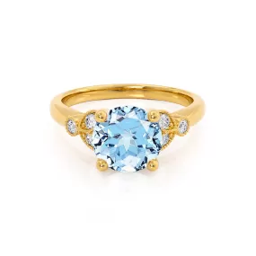 DELILAH - Chatham® Round Aqua Spinel 18k Yellow Gold Shoulder Set Ring